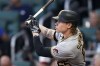 Pittsburgh Pirates' Jack Suwinski watches his solo home run in the fourth inning of the team's baseball game against the Atlanta Braves on Thursday, June 9, 2022, in Atlanta. (AP Photo/John Bazemore)