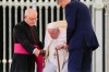 Pope Francis is helped to stand up by his aide Monsignor Leonardo Sapienza, left, at the end of the weekly general audience in St. Peter's Square at The Vatican, Wednesday, June 8, 2022. (AP Photo/Alessandra Tarantino)