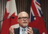 Dr. Kieran Moore, Ontario's Chief Medical Officer of Health speaks at a press conference during the COVID-19 pandemic, at Queen’s Park in Toronto on Monday, April 11, 2022.  Ontario's top doctor says he and other health officials are planning for a new round of COVID-19 booster doses to be rolled out this fall. THE CANADIAN PRESS/Nathan Denette