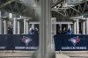 Fans arrive at the Rogers Centre ahead of MLB baseball action in Toronto on April 17, 2022. Blue Jays president Mark Shapiro is asking the City of Toronto to end a program that closes a busy roadway near Rogers Centre on weekends to allow for pedestrian traffic. THE CANADIAN PRESS/Christopher Katsarov