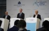 Christine Lagarde, European Central Bank President, behind blue lectern, Vice-President Luis de Guindos, left, and Netherlands Bank (DNB) President Klaas Knot, second left, explain the Governing Council's monetary policy decisions during a press conference in Amsterdam, Netherlands, Thursday, June 9, 2022. The European Central Bank said it would carry out its first interest rate increase in 11 years in July, followed by another hike in September. The bank made the surprise move Thursday, saying that inflation had become a 