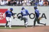 Kansas City Royals left fielder Hunter Dozier, from left, third baseman Emmanuel Rivera (26) and shortstop Bobby Witt Jr. watch as a single hit by San Francisco Giants' Brandon Crawford lands during the fourth inning of a baseball game in San Francisco, Wednesday, June 15, 2022. (AP Photo/Jeff Chiu)