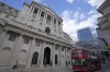 FILE - A bus drives past the Bank of England before the release of the Monetary Policy Report at the Bank of England in London, Thursday, May 5, 2022. The Bank of England is under pressure to raise interest rates more aggressively amid concern that the quarter-percentage-point hike expected Thursday will do little to combat price increases that have pushed inflation to a 40-year high. (AP Photo/Frank Augstein, File)