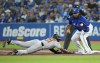 Baltimore Orioles centre-fielder Cedric Mullins (31) slides back into first base as Toronto Blue Jays first baseman Vladimir Guerrero Jr. (27) waits for the throw during first inning American League baseball action in Toronto on Thursday, June 16, 2022. THE CANADIAN PRESS/Nathan Denette