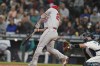 Los Angeles Angels' Mike Trout hits a two-run home run during the seventh inning of the team's baseball game against the Seattle Mariners, Thursday, June 16, 2022, in Seattle. The homer was Trout's second of the game. (AP Photo/Ted S. Warren)