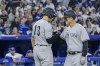 New York Yankees first baseman Anthony Rizzo (right) and left-fielder Joey Gallo (13) celebrate after Rizzo hit a grand slam during fifth inning MLB baseball action against the Toronto Blue Jays, in Toronto on Friday, June 17, 2022. THE CANADIAN PRESS/Christopher Katsarov