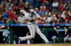 Miami Marlins' Jacob Stallings hits a three-run home run off Philadelphia Phillies' Jeurys Familia during the seventh inning of a baseball game Tuesday, June 14, 2022, in Philadelphia. The Marlins won 11-9. (AP Photo/Matt Rourke)