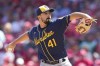 Milwaukee Brewers starting pitcher Jason Alexander throws during the first inning of a baseball game against the Cincinnati Reds, Saturday, June 18, 2022, in Cincinnati. (AP Photo/Jeff Dean)