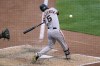 San Francisco Giants' Mike Yastrzemski hits a sacrifice fly to center field off Pittsburgh Pirates relief pitcher Wil Crowe during the sixth inning of a baseball game in Pittsburgh, Saturday, June 18, 2022. (AP Photo/Gene J. Puskar)