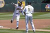 Oakland Athletics' Seth Brown (15) gestures after hitting a home run as he rounds the bases toward third base coach Darren Bush (51) during the first inning of a baseball game against the Kansas City Royals in Oakland, Calif., Sunday, June 19, 2022. (AP Photo/Jeff Chiu)