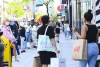 People shop and wait in long lines to enter stores along Queen Street West in downtown Toronto on Friday, June 11, 2021. Statistics Canada says retail sales rose 0.9 per cent to $60.7 billion in April, boosted by gains at general merchandise stores. The agency also said its early estimate for retail sales in May suggested a gain of 1.6 per cent for the month, but cautioned the figure would be revised.THE CANADIAN PRESS/Nathan Denette