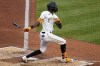 Pittsburgh Pirates' Oneil Cruz singles off Chicago Cubs starting pitcher Matt Swarmer, driving in a run, during the third inning of a baseball game against the Chicago Cubs in Pittsburgh, Tuesday, June 21, 2022. (AP Photo/Gene J. Puskar)