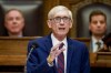 FILE - Wisconsin Gov. Tony Evers addresses a joint session of the Legislature in the Assembly chambers at the state Capitol in Madison, Wis. on Feb. 15, 2022. Evers on Tuesday, June 21, 2022, issued an executive order declaring that an abnormal economic disruption exists in Wisconsin due to a disruption of energy supplies, allowing him to trigger a state ban on price gouging of gasoline and diesel. (AP Photo/Andy Manis, File)