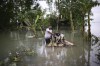 A man uses banana plants for floatation as he transports his goats through flood waters in Sylhet, Bangladesh, Tuesday, June 21, 2022. Villagers in northeastern Bangladesh are crowding makeshift refugee centers and scrambling to meet boats arriving with food and fresh water as massive floods, which have killed dozens of people and displaced hundreds of thousands. (AP Photo/Mahmud Hossain Opu)