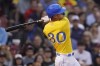 Boston Red Sox's Rob Refsnyder watches the flight of his two run home run during the third inning of a baseball game against the Detroit Tigers, Wednesday, June 22, 2022, at Fenway Park in Boston. (AP Photo/Charles Krupa)