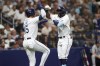 Tampa Bay Rays' Vidal Brujan, right, celebrates with Josh Lowe after hitting a two-run home run against the New York Yankees during the second inning of a baseball game Wednesday, June 22, 2022, in St. Petersburg, Fla. (AP Photo/Scott Audette)