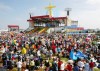 After early morning morning rain, blue skies appear during the World Youth Day papal mass at Downsview Park in Toronto, Sunday July 28, 2002. THE CANADIAN PRESS/Paul Chiasson