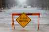 Stalled cars on a flooded and closed Pritchard Farm Road in East Saint Paul on Sunday. (John Woods / Winnipeg Free Press)