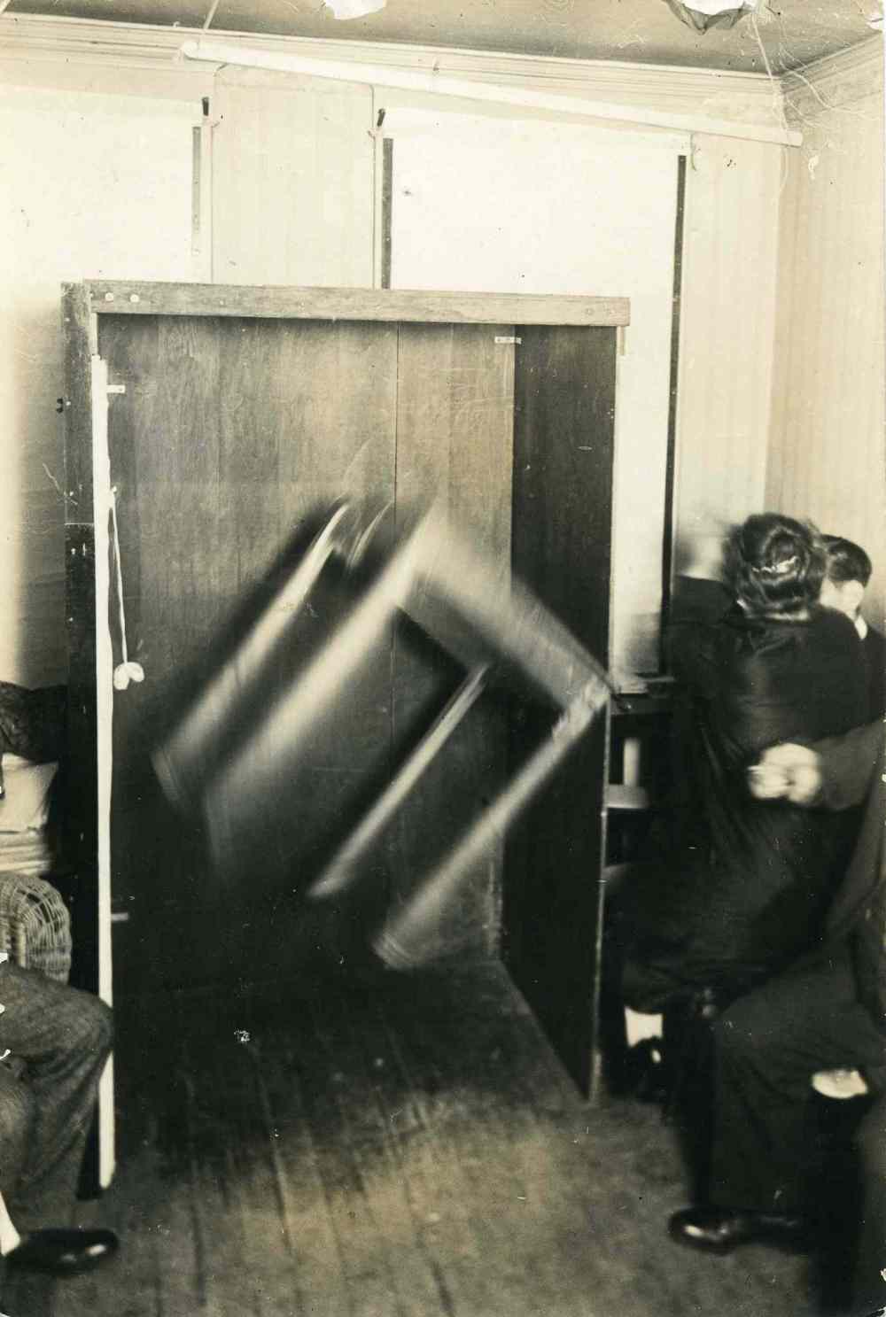 UofM Archives/Hamilton Family fonds
A photograph of the medium, Mrs. Poole, levitating and inverting a table through telekinetic energy during a seance at the home of Dr. Thomas Glendenning Hamilton on May 16, 1926.  (UofM Archives/Hamilton Family fonds)