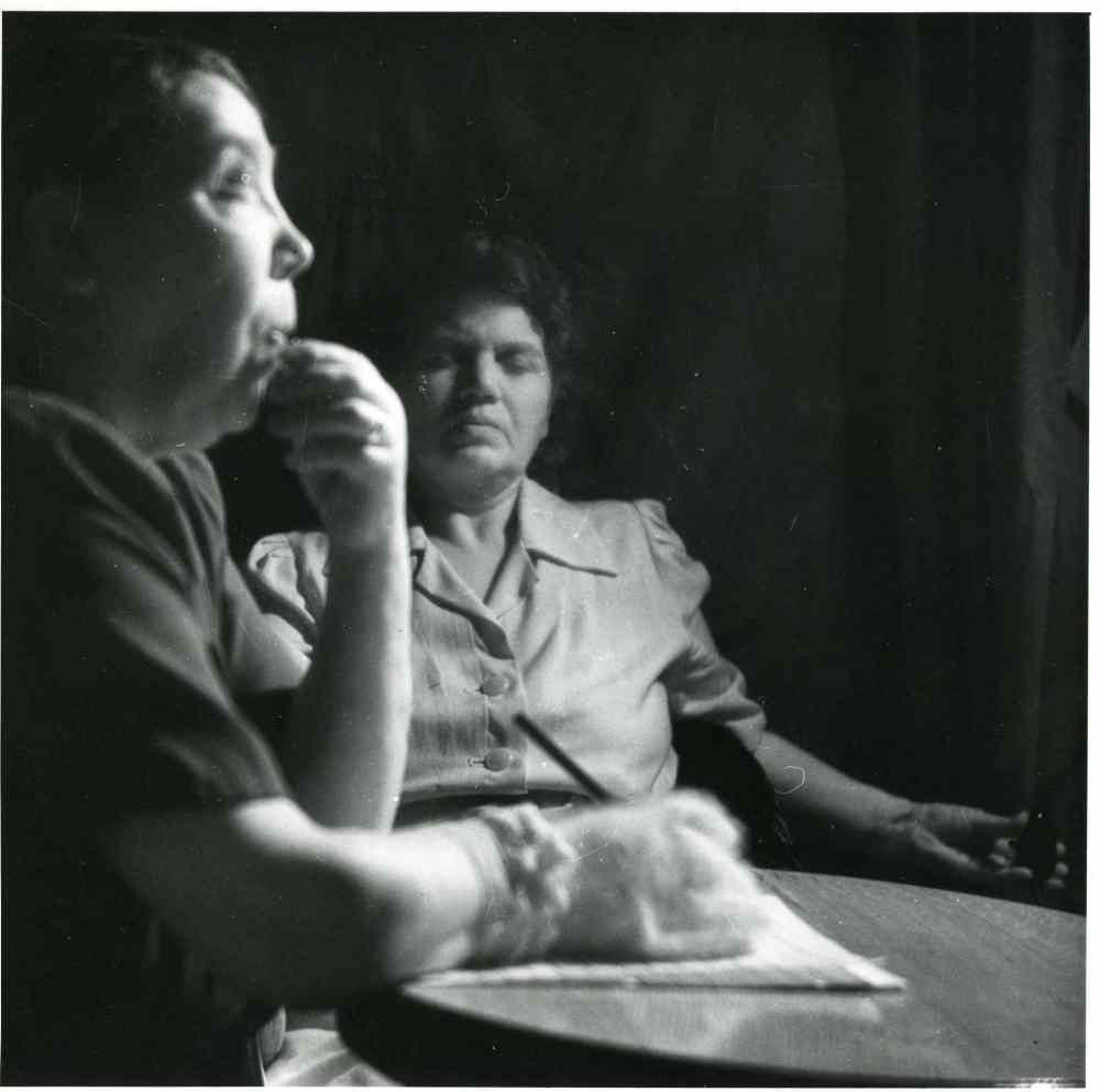 UofM Archives/Hamilton Family fonds
A photograph of the medium, Mary Marshall, writing a letter in complete darkness while under the control of the spirit, Walter, during a seance at the home of Sylvia Barber ca. 1947-1951.  (UofM Archives/Hamilton Family fonds)