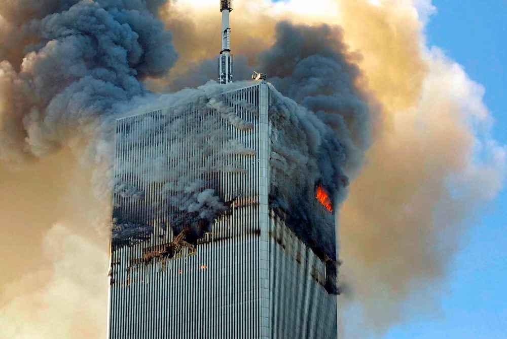 Fire and smoke billows from the north tower of New York