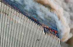 A person falls from the north tower of New York