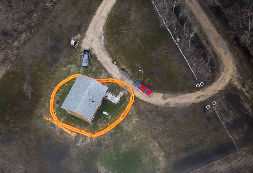 A home on Peguis First Nation with a Tiger Dam around it. Residents of the community were evacuated because of the Fisher River flooding. The river levels have dropped considerably this week. (John Woods / Pool / Canadian Press)