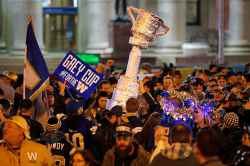 CP
Winnipeg Blue Bomber fans celebrate winning the 107th Grey Cup over the Hamilton Tiger Cats at the intersection of Portage and Main in Winnipeg. (John Woods / Canadian Press)