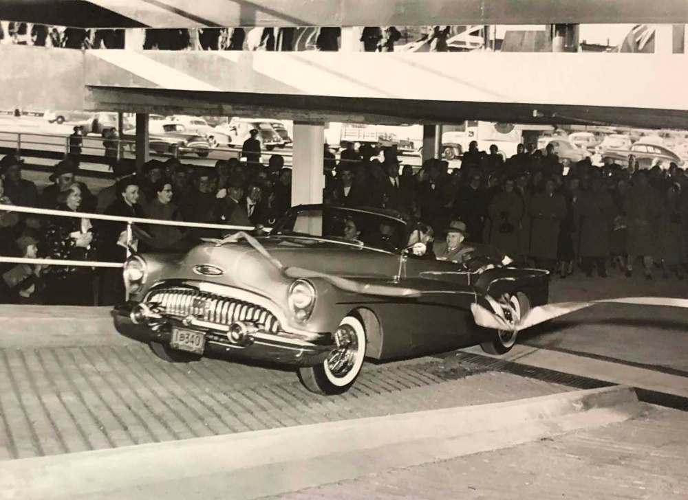 HBC ARCHIVES
The Bay store manager and first customers drive through a ribbon on Oct. 19, 1954, the day the Bay Parkade opened.