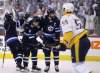 Winnipeg Jets' Josh Morrissey (44), Jacob Trouba (8) and Blake Wheeler (26) celebrate after Trouba scored against the Nashville Predators during second period NHL hockey playoff action in Winnipeg, Tuesday, May 1, 2018. THE CANADIAN PRESS/Trevor Hagan