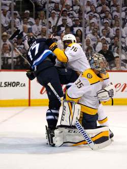 PHIL HOSSACK / Winnipeg Free Press - Nashville Predator #76 P.K. Subban makes short work of Winnipeg Jet #17 Adam Lowrey as Predator netminder Pekka Rinne covers up in the second period of NHL game four playoff action in Winnipeg on Wednesday, May 3, 2018.