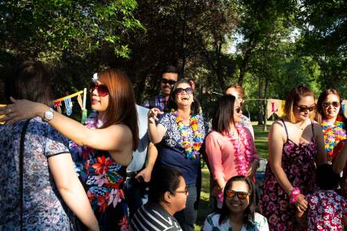 Gina Arroza (centre) beams after being surprised with a 50th birthday bash in Kildonan Park.