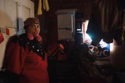 Amber Bracken photo
Gitxsan supporter Shaylynn Sampson, of Lax Gibuu Wilp Spookxw, with her back to the door as others watch the window, just moments before police break down the door with an axe and a chainsaw at Coyote Camp in Gidimt’en territory.