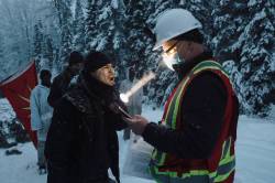 Amber Bracken photo
Haudenosaunee supporter Teka’tsihasere (Corey Jocko), aka Jayohcee, whoops in response to a Coastal GasLink worker reading the injunction in Gidimt’en territory on Nov. 14.