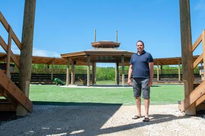 Chief Gordon Bluesky checks out the new community arbour being built at Brokenhead Ojibway Nation. The facility will host events such as powwows and Treaty Days at the First Nation. (Ethan Cairns / Winnipeg Free Press)