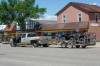 MIKE DEAL / WINNIPEG FREE PRESS 
A pickup truck and a trailer with ATVs sits in the middle of Saskatchewan Avenue East in Portage la Prairie on Wednesday. The driver was shot by an officer after allegedly driving at him.