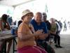 JESSICA LEE / WINNIPEG FREE PRESS
Ellinor Heldt and husband Helmut  applaud Gerry “The Big Bear” Barrett at the Red River Exhibition Wednesday.