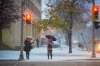 MIKAELA MACKENZIE / WINNIPEG FREE PRESS
Pedestrians wait to cross the street during the first snowfall of the year in Winnipeg on Thursday.