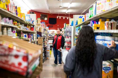 Food Fare owner Husni Zeid, owner, talks with his daughter, Hanan. (Mikaela MacKenzie / Winnipeg Free Press)