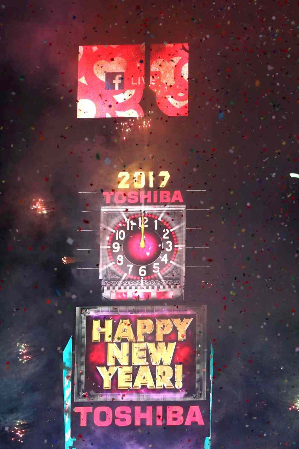 The clock strikes midnight at the New Year's Eve celebration in Times Square on Sunday, Jan. 1, 2017, in New York. (Photo by Greg Allen/Invision/AP)