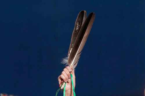 ADRIAN WYLD / THE CANADIAN PRESS  

Eagle feathers are held up during the National Day for Truth and Reconciliation in Ottawa on Thursday, Sept. 30, 2021.