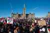 Supporters arrive at Parliament Hill for the Freedom Truck Convoy to protest against COVID-19 vaccine mandates and restrictions in Ottawa, Canada, on Saturday, Jan. 29, 2022. (Lars Hagberg/AFP/Getty Images/TNS)