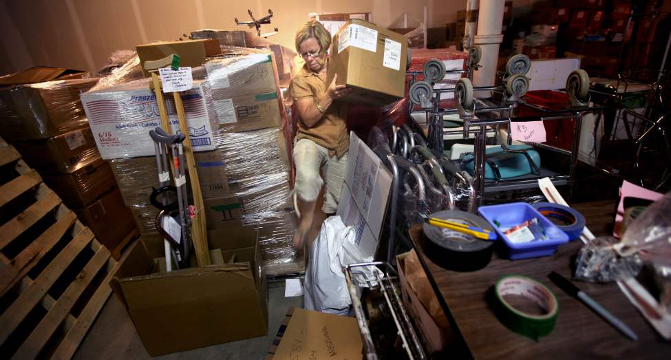 In October 2012 a medical team of surgeons, nurses, physiotherapists and support stuff traveled from Winnipeg to Managua, Nicaragua to perform knee replacements for those who normally could not afford surgeries. Free Press photojournalist Phil Hossack documented the trip.
Prior to the trip nurse Karen Watchorn shifts supplies in a St. James warehouse readying the inventory for shipment to Nicaraugua.