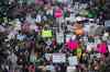 Demonstrators march across 42nd Street during a women's march, Saturday, Jan. 21, 2017, in New York. The march is being held in solidarity with similar events taking place in Washington and around the nation. (AP Photo/Mary Altaffer)