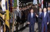 U.S. President Joe Biden, right, waves as he walks past Bavarian mountain riflemen and traditional costumers after his arrival at Franz-Josef-Strauss Airport near Munich, Germany, Saturday, June 25, 2022, ahead of the G7 summit. Biden is in Germany to attend a Group of Seven summit of leaders of the world's major industrialized nations. (Daniel Karmann/dpa via AP)