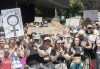 People take part in a protest to denounce the United States Supreme Court's decision to overturn the law that provided the constitutional right to abortion for almost 50 years, in Montreal, Sunday, June 26, 2022. THE CANADIAN PRESS/Graham Hughes