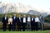 Members of the G7 from left, Prime Minister of Italy Mario Draghi, European Commission President Ursula von der Leyen, President Joe Biden, German Chancellor Olaf Scholz, British Prime Minister Boris Johnson, Canadian Prime Minister Justin Trudeau, Prime Minister of Japan Fumio Kishida, French President Emmanuel Macron and European Council President Charles Michel stand for a photo at Schloss Elmau following their dinner at G7 Summit in Elmau, Germany, Sunday, June 26, 2022. The bench behind them became famous when former German Chancellor Angela Merkel and former President Barack Obama were photographed talking by it. (AP Photo/Susan Walsh)