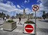 Signs are pictured on Parliament Hill prior to Canada Day, in Ottawa on Monday, June 27, 2022. Ottawa's mayor and chief of police say they are ready as the city braces for a new round of protests that are expected to start on Canada Day. THE CANADIAN PRESS/Sean Kilpatrick