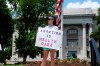 FILE - Abortion-rights demonstrator Jessica Smith holds a sign in front of the Hamilton County Court House on May 14, 2022, in Chattanooga, Tenn. A federal court on Tuesday, June 28, 2022, allowed Tennessee's ban on abortion as early as six weeks into pregnancy to take effect, citing the Supreme Court's decision last week to overturn the landmark Roe v. Wade abortion rights case. (AP Photo/Ben Margot, File)