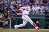 Washington Nationals' Juan Soto watches his single during the first inning of the team's baseball game against the Pittsburgh Pirates at Nationals Park, Tuesday, June 28, 2022, in Washington. (AP Photo/Alex Brandon)